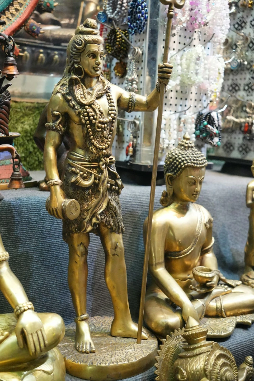 Golden statues of hindu deities and buddha